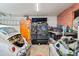 View of cluttered garage interior, showcasing potential storage and workspace at 701 Emporia St, Aurora, CO 80010