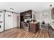 Open kitchen layout with stainless steel appliances, wooden cabinets, and a convenient washer and dryer at 701 Emporia St, Aurora, CO 80010