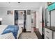 Bedroom featuring open closet, hardwood floors and lots of natural light at 701 Emporia St, Aurora, CO 80010