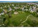Aerial view of a community park featuring a playground, open green space, and walking paths at 17372 E Prentice Cir, Centennial, CO 80015