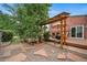 Backyard with a wood pergola, patio dining area, barbecue, and landscaped garden at 17372 E Prentice Cir, Centennial, CO 80015