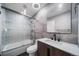 Updated bathroom features a sleek vanity, subway tile shower, and glass door at 17372 E Prentice Cir, Centennial, CO 80015