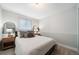 Calming bedroom with neutral tones, carpeted floors, and a comfortable queen-sized bed with stylish pillows at 17372 E Prentice Cir, Centennial, CO 80015