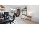 Well-lit bedroom space with two desks and storage, ideal for a home office or study area at 17372 E Prentice Cir, Centennial, CO 80015
