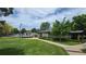 Enjoy community amenities like a pool and clubhouse, with lush green lawns and walking paths at 17372 E Prentice Cir, Centennial, CO 80015