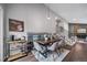 Open-concept dining area with modern lighting, stairs, and decor at 17372 E Prentice Cir, Centennial, CO 80015
