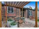 Inviting front entrance featuring a cozy bench and stylish pergola for a warm welcome at 17372 E Prentice Cir, Centennial, CO 80015