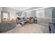 Spacious basement living area features comfortable seating and bright natural light at 17372 E Prentice Cir, Centennial, CO 80015