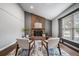 Cozy living room showcases a brick fireplace and plenty of natural light at 17372 E Prentice Cir, Centennial, CO 80015