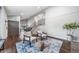 Inviting living room featuring hardwood floors, neutral paint, staircase, and a decorative rug with seating at 17372 E Prentice Cir, Centennial, CO 80015