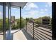 Balcony featuring sleek railing with street views, offering a modern urban experience at 2374 S University Blvd # 202, Denver, CO 80210