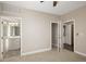 Inviting bedroom featuring plush carpeting and multiple doors for closet, bathroom, and laundry access at 2374 S University Blvd # 202, Denver, CO 80210