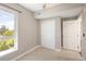 Bright bedroom features neutral carpeting, a sliding door closet, and a large window for natural light at 2374 S University Blvd # 202, Denver, CO 80210