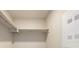 Bright closet featuring shelving and a stacked washer/dryer at 2374 S University Blvd # 202, Denver, CO 80210