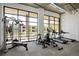 Bright gym featuring workout equipment and large windows, perfect for maintaining an active lifestyle at 2374 S University Blvd # 202, Denver, CO 80210