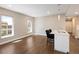 Bright living room featuring modern finishes, wood floors, and a kitchen island with counter seating at 2374 S University Blvd # 202, Denver, CO 80210