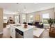 Bright open concept living room and kitchen with stainless steel appliances and hardwood floors at 2374 S University Blvd # 202, Denver, CO 80210