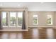 Bright and airy living room featuring hardwood floors and large windows at 2374 S University Blvd # 202, Denver, CO 80210
