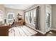 Modern home office with large windows, hardwood floors, and contemporary design at 2374 S University Blvd # 202, Denver, CO 80210