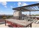 Charming rooftop deck with a wooden table and seating, perfect for outdoor dining at 2374 S University Blvd # 202, Denver, CO 80210