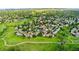 Lush green lawns and tree-lined streets create a serene atmosphere in this spacious aerial view of the neighborhood at 517 Chiswick Cir, Highlands Ranch, CO 80126