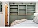 Charming bedroom features built-in closet with modern lighting and neutral decor at 517 Chiswick Cir, Highlands Ranch, CO 80126