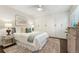 Bright bedroom boasts custom built-in closets, ceiling fan, and a calming color palette at 517 Chiswick Cir, Highlands Ranch, CO 80126