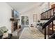 Bright living room with vaulted ceilings, a brick fireplace, and sliding doors leading to the deck at 517 Chiswick Cir, Highlands Ranch, CO 80126