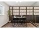 Bright office space features a unique accent wall, modern desk, and a stylish mirror at 517 Chiswick Cir, Highlands Ranch, CO 80126