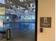 Martial arts studio featuring a padded floor, mirrors, and natural light at 517 Chiswick Cir, Highlands Ranch, CO 80126