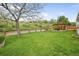 Expansive backyard with lush green grass and a patio area, perfect for outdoor activities and relaxation at 225 Berthoud Way, Golden, CO 80401