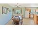 Inviting dining area featuring hardwood floors, a bay window, and a charming light fixture at 225 Berthoud Way, Golden, CO 80401
