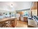 Bright kitchen and dining area with hardwood floors, functional appliances, and ample natural light at 225 Berthoud Way, Golden, CO 80401