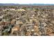 An aerial view depicts a suburban neighborhood with a mix of tree coverage and houses at 2237 S Lowell Blvd, Denver, CO 80219