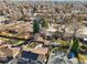 A high aerial view showcases the neighborhood's mature trees and neatly arranged single-Gathering homes at 2237 S Lowell Blvd, Denver, CO 80219