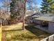 Birds eye view of grassy backyard with patio and storage shed at 2237 S Lowell Blvd, Denver, CO 80219