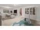Open basement area featuring neutral tones, built in shelving, and a comfortable seating area with a large screen TV at 2237 S Lowell Blvd, Denver, CO 80219