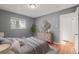 Comfortable bedroom with hardwood floors and neutral decor for a relaxing ambiance at 2237 S Lowell Blvd, Denver, CO 80219