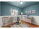 Charming Bedroom with hardwood floors, soft colors, and plenty of space for play at 2237 S Lowell Blvd, Denver, CO 80219