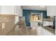 Modern kitchen with stainless steel appliances, a granite countertop and a door to an outdoor area at 2237 S Lowell Blvd, Denver, CO 80219