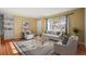 Bright living room with hardwood floors, a large window, and stylish decor creating a welcoming atmosphere at 2237 S Lowell Blvd, Denver, CO 80219