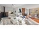 Bright and inviting living room featuring a modern wood stove and plush, comfortable seating at 2237 S Lowell Blvd, Denver, CO 80219