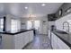 A bright kitchen offering a center island, and plenty of counterspace at 5936 Turnstone Pl, Castle Rock, CO 80104