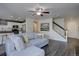 A spacious living room with modern staircase and open to the kitchen at 5936 Turnstone Pl, Castle Rock, CO 80104