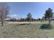 Community playground with slides and a basketball court for recreational activities at 5936 Turnstone Pl, Castle Rock, CO 80104