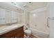 A full bathroom with a shower and tub combination, vanity, and tile walls at 8555 Fairmount Dr # A108, Denver, CO 80247