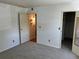 Bedroom showing the door and carpeted floors at 8555 Fairmount Dr # A108, Denver, CO 80247