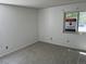 Bedroom featuring a view of an outdoor area visible through a window at 8555 Fairmount Dr # A108, Denver, CO 80247