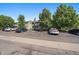 Apartment building with multiple units, balconies, and parking spaces for residents at 8555 Fairmount Dr # A108, Denver, CO 80247