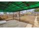 Backyard patio with a metal awning features a spacious area with a wooden fence and ample space for outdoor enjoyment at 3550 Fairfax St, Denver, CO 80207